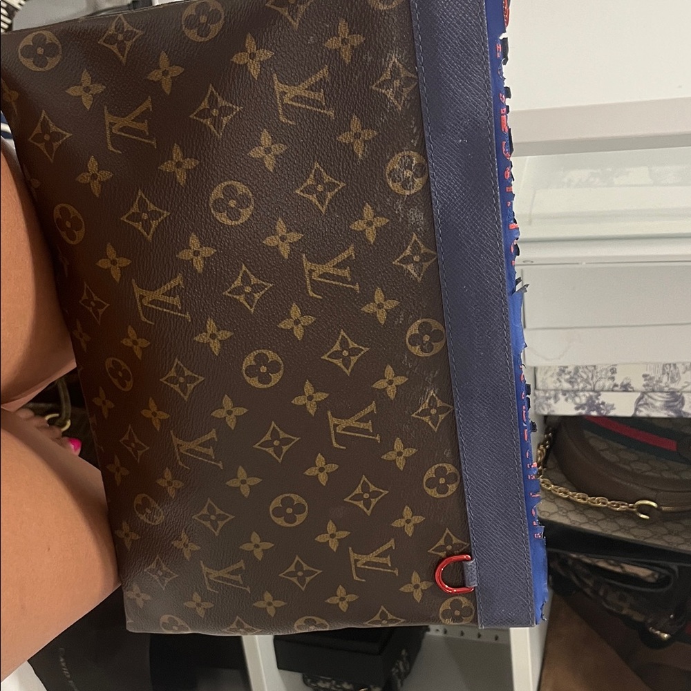 Louis Vuitton Monogram Brown and Blue Toiletry Bag
Women’s Clutch